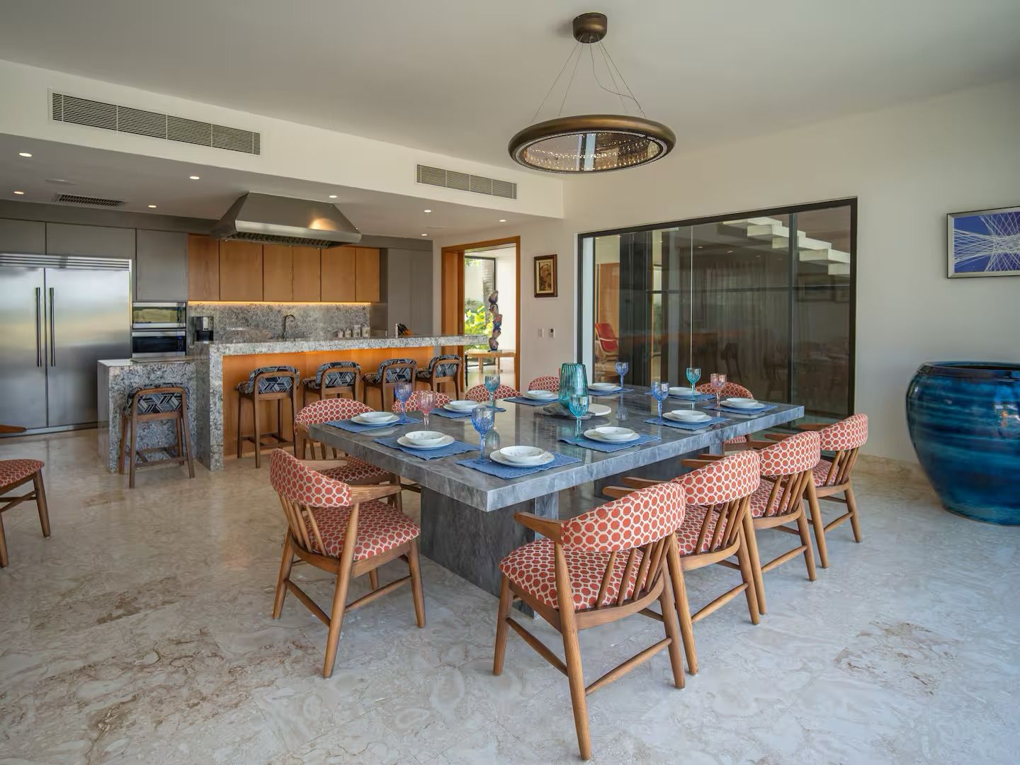 Marble dining table and open kitchen at 5BR Vista Lagos 16