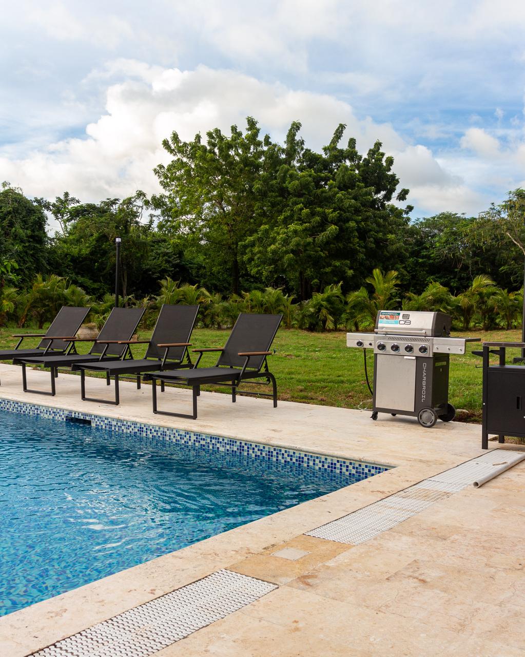 Pool with sun loungers at 8BR Barranca Estate