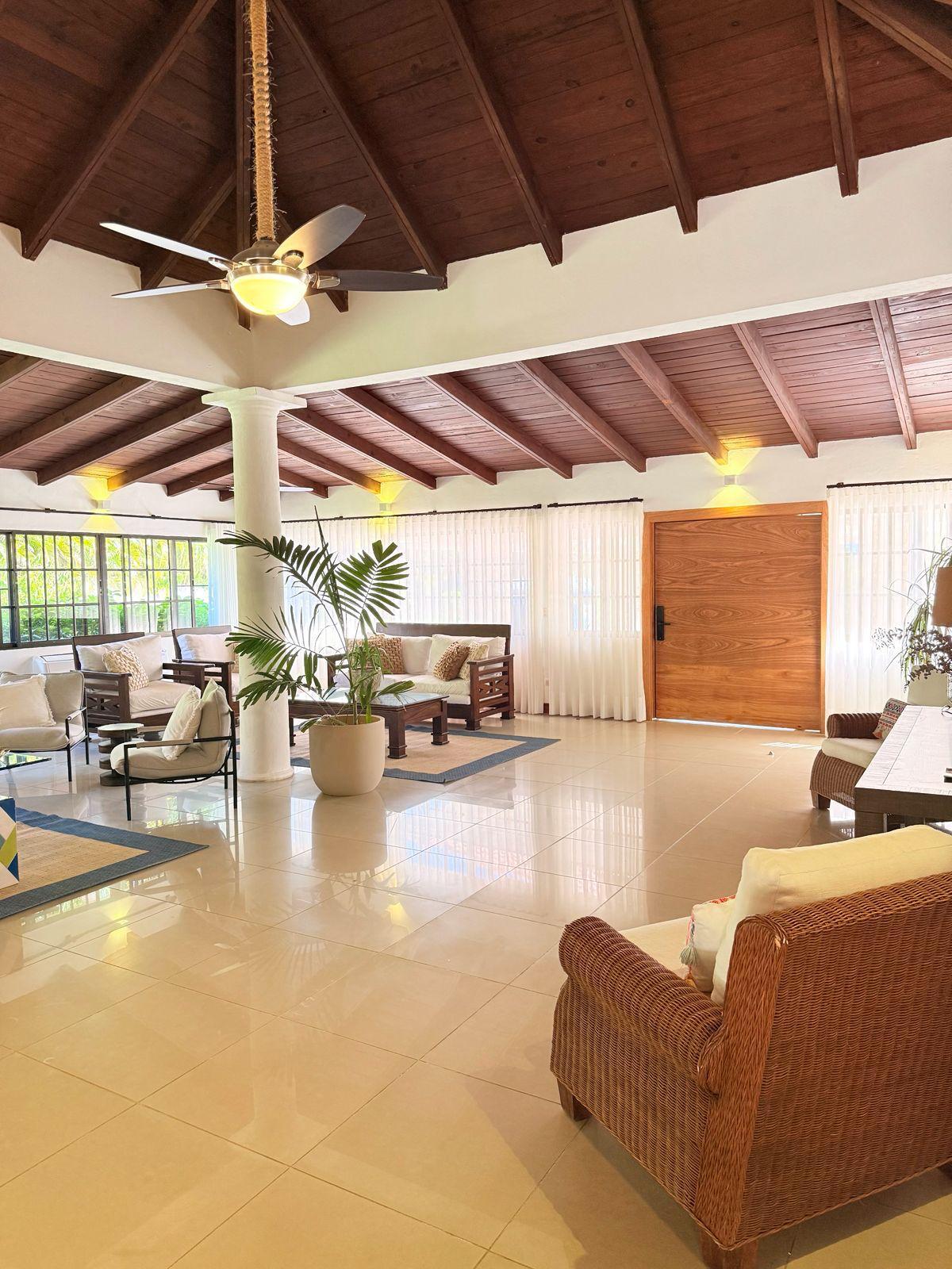 Living room under vaulted timber ceilings at 5BR Cajuiles 24