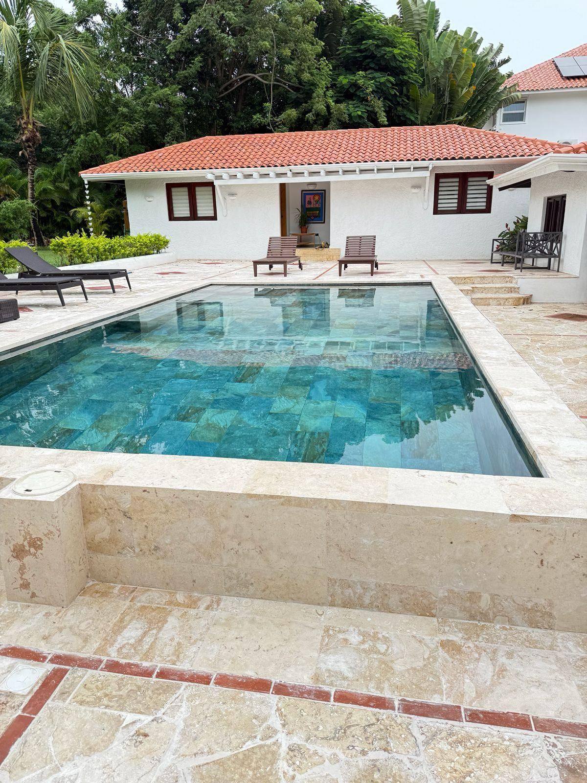 Coral-stone pool and pool house at 5BR Cajuiles Garden Villa