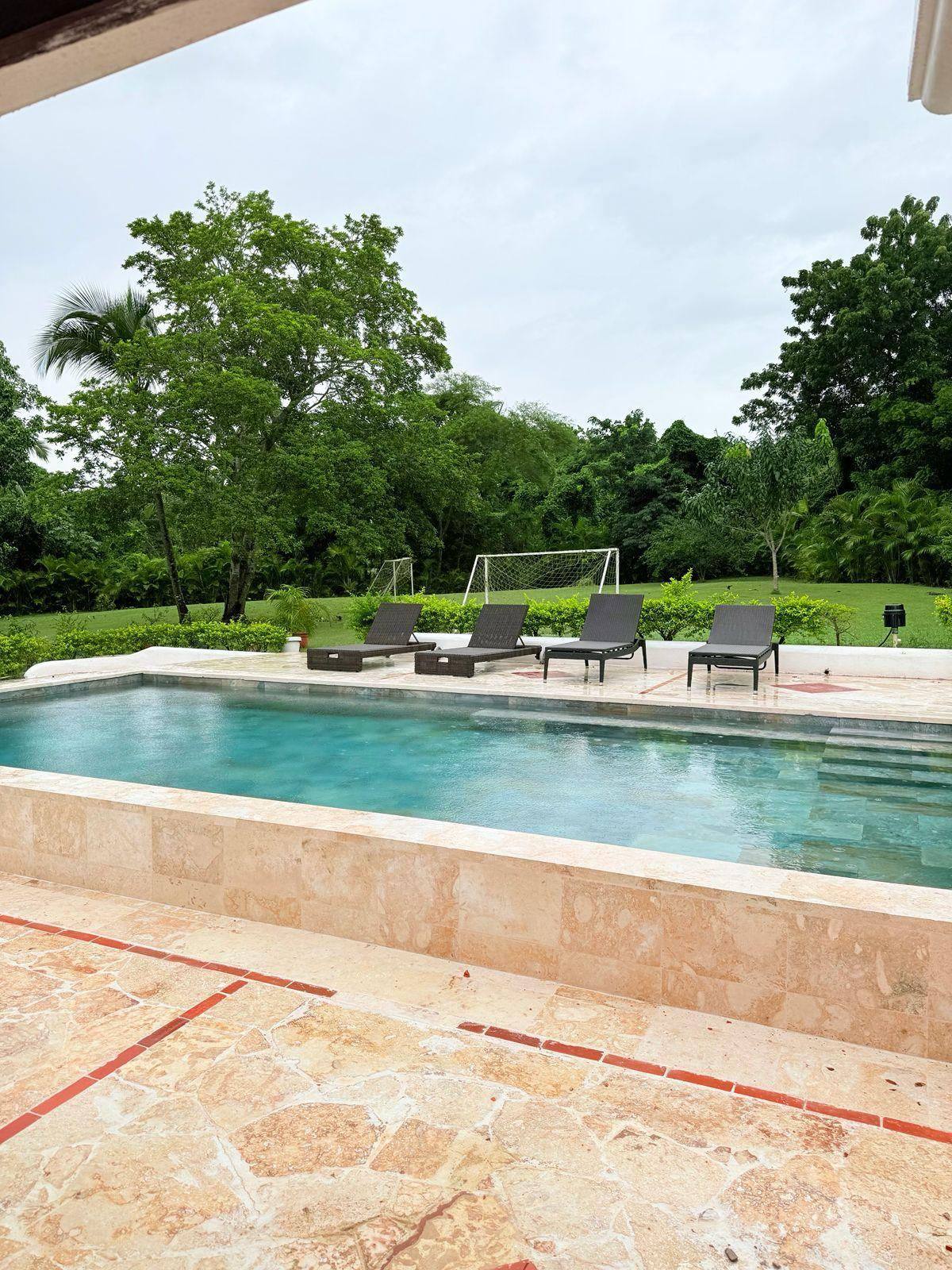 Pool overlooking the lawn at 5BR Cajuiles Garden Villa