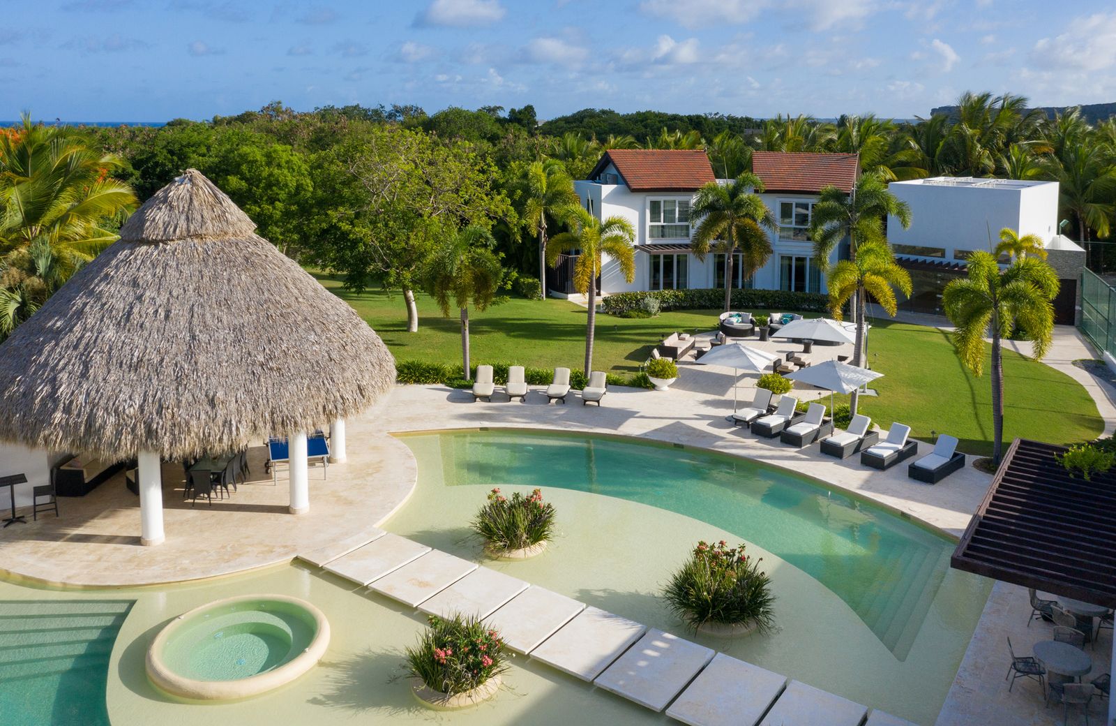 Pools and palapa at the Luxury Villa in Cap Cana