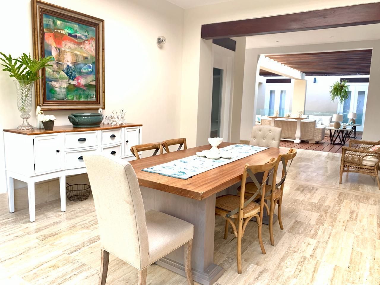 Dining room opening to the terrace at the 7BR Las Lomas Villa