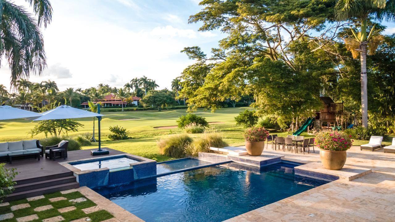 Pool and jacuzzi overlooking the fairway at 5BR Las Palmas Tropical Estate