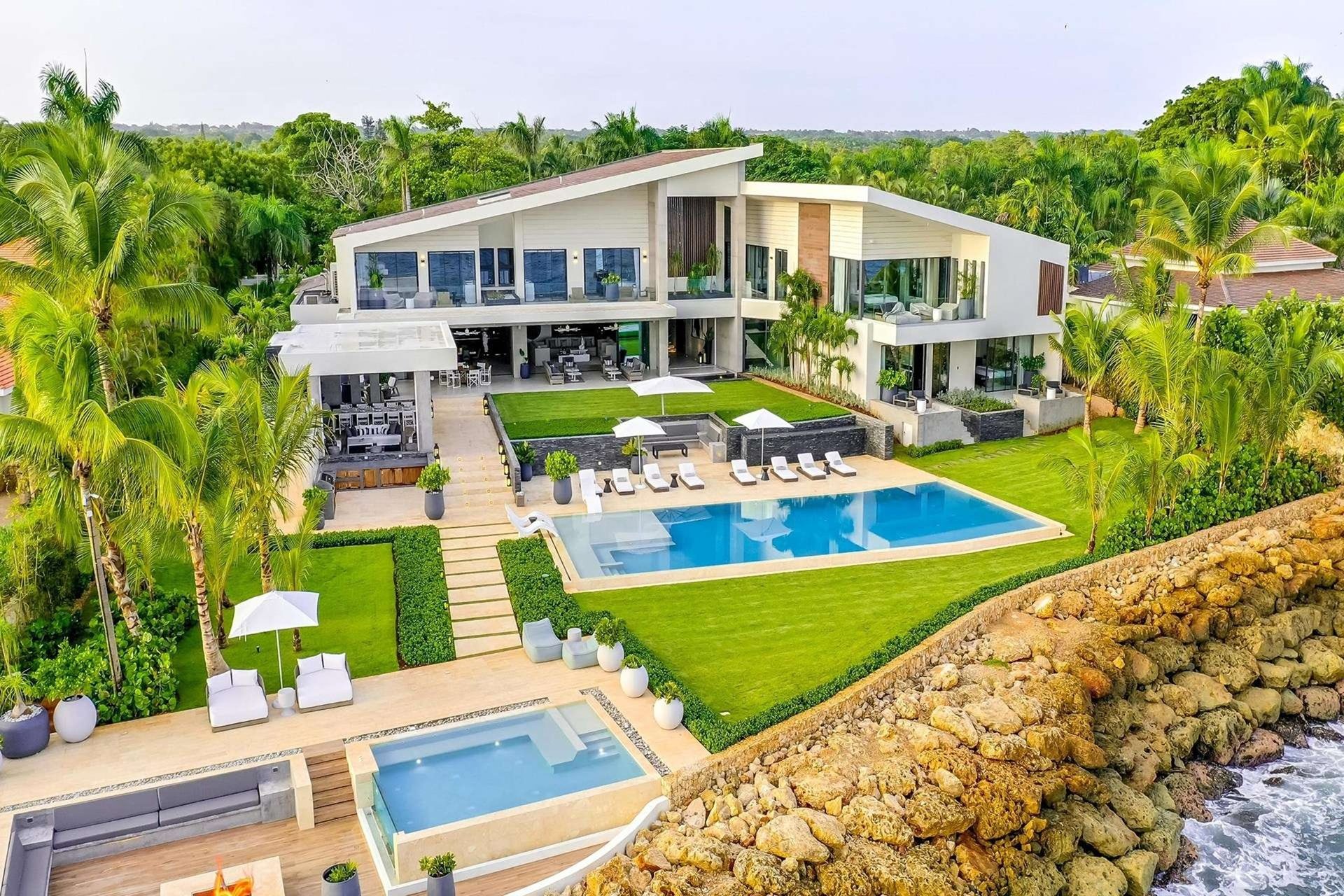Aerial view of the villa, lawn, infinity pool and plunge pool on a coral point above the sea, Punta Minitas Modern Ocean Villa, Casa de Campo