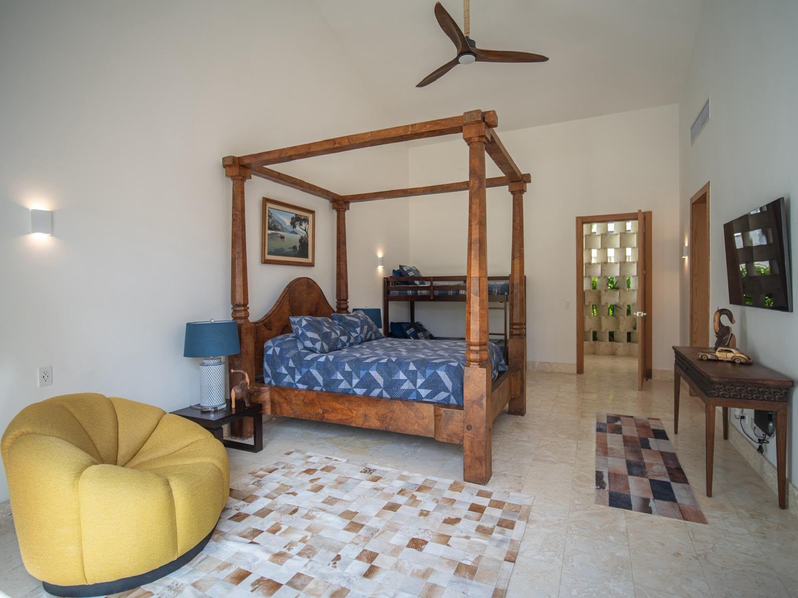 Suite with hand-carved four-poster bed and timber ceiling