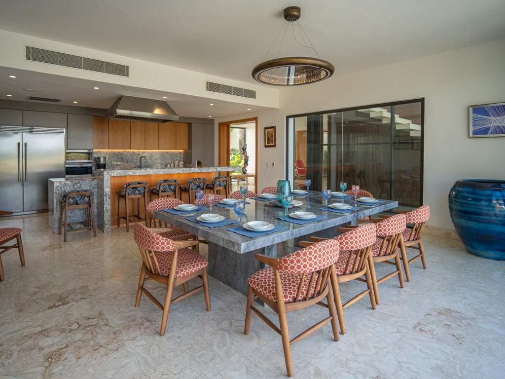 Marble dining table and open kitchen at Vista Lagos Private Estate